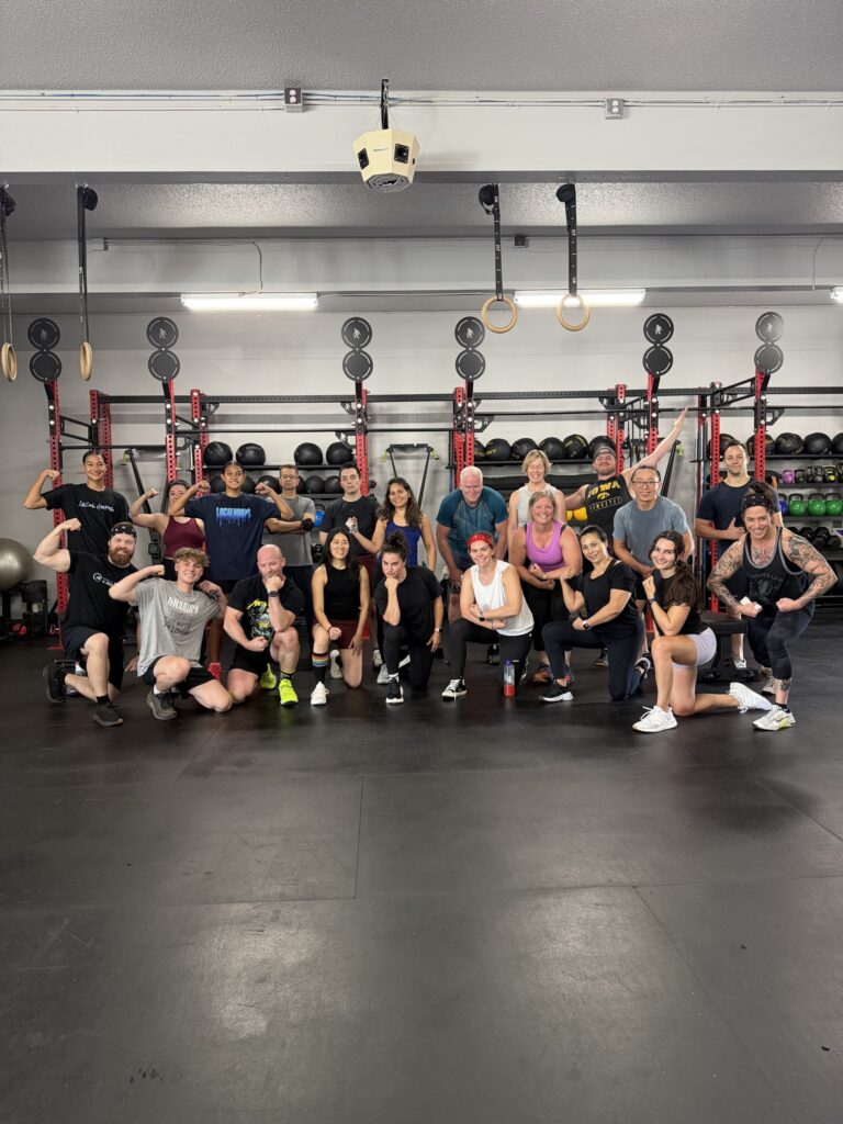 FX Fusion class members posing together after a session at Ideal Strength & Performance in Bellevue